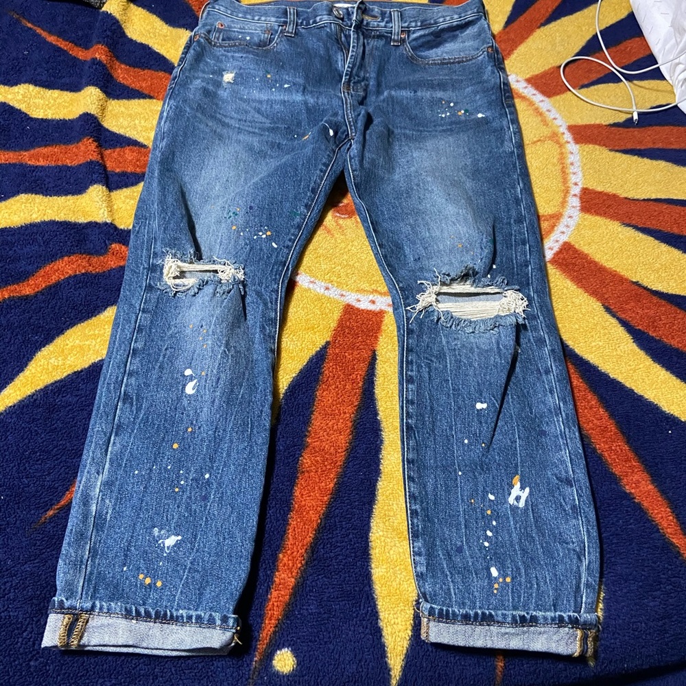 Ripped jeans with paint splatter